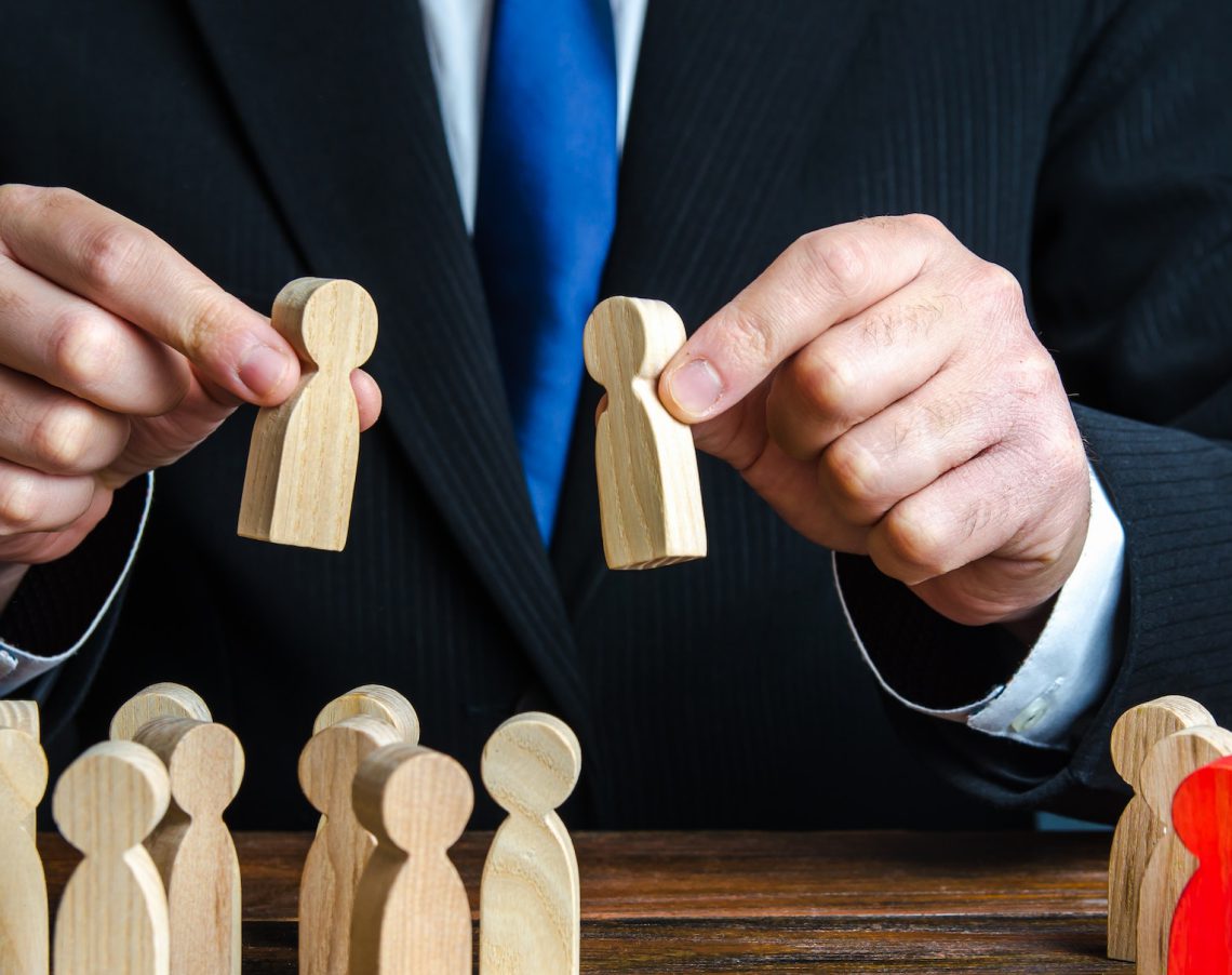 A businessman evaluates candidates for employment. A businessman evaluates candidates for employment.